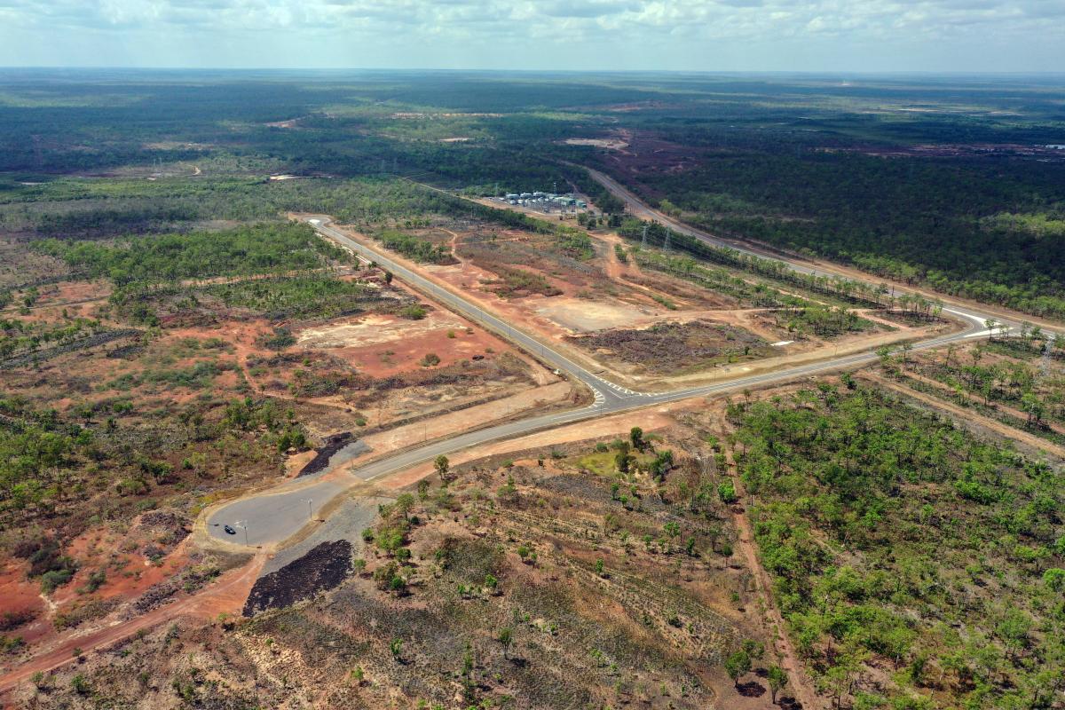 Aerial view of Middle Arm Precinct showing subdivided land, earthworks and surrounding bushland