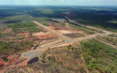 Aerial view of Middle Arm Precinct showing subdivided land, earthworks and surrounding bushland